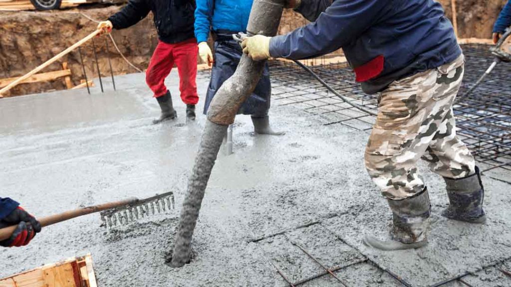 Concrete driveway being poured and finished at a Wollongong home