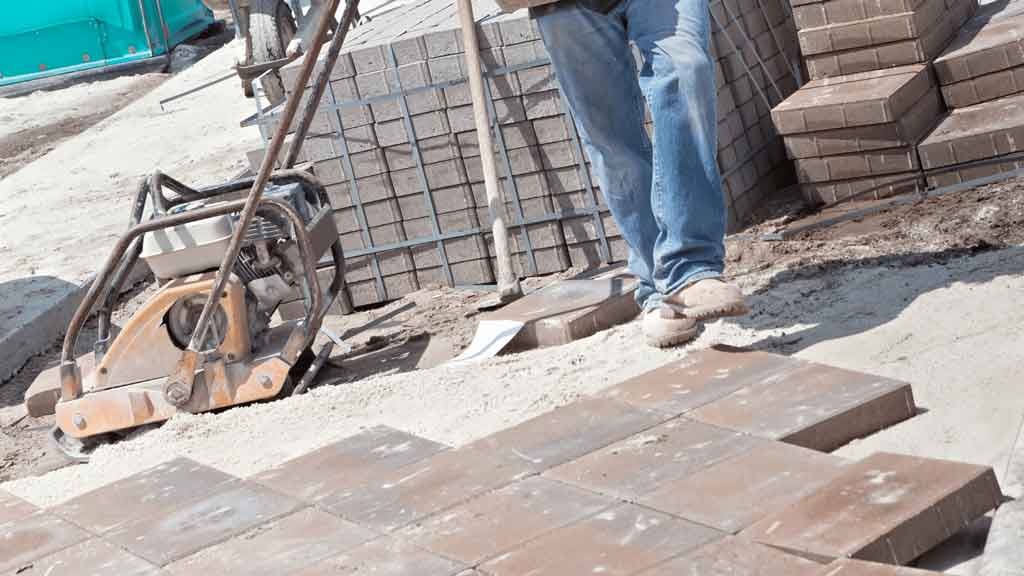 Professional concreter at work on a residential concrete project in Wollongong